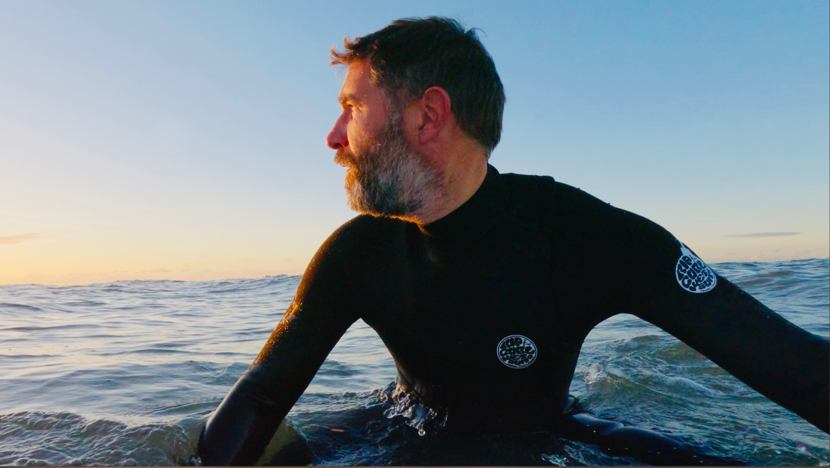 Rick in the water at golden hour