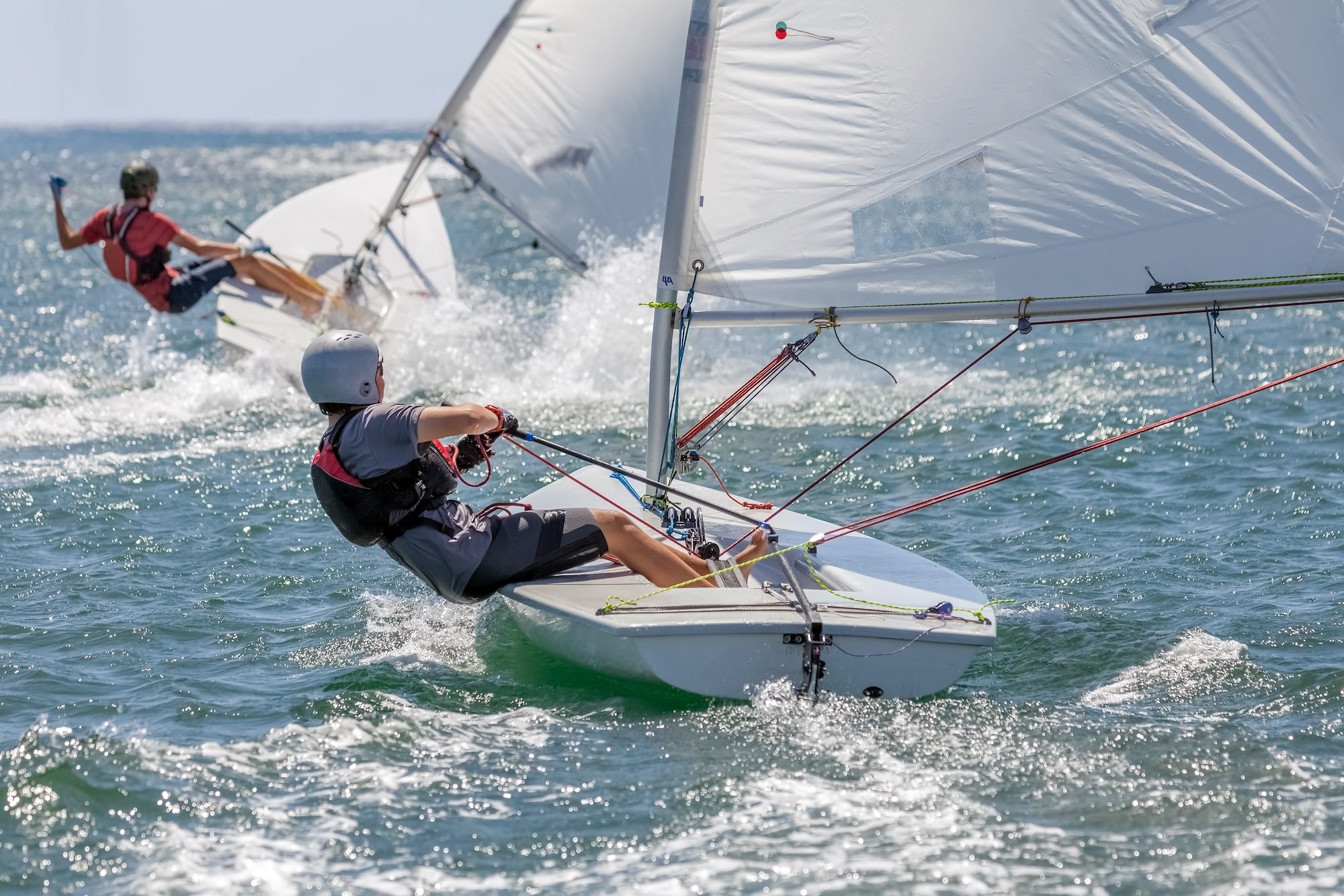 Sailors racing on the water